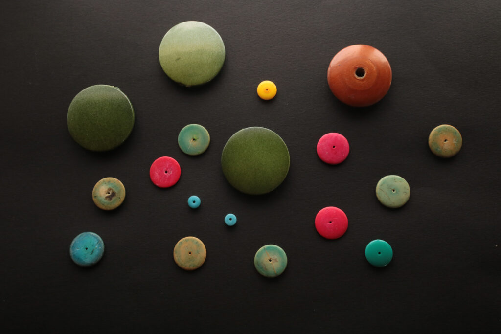 assorted round buttons of various sizes and colors